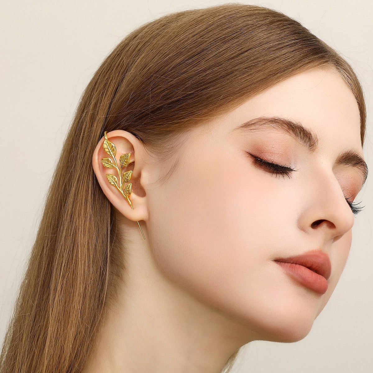 Whispering Leaves ear cuff worn on the ear, profile view