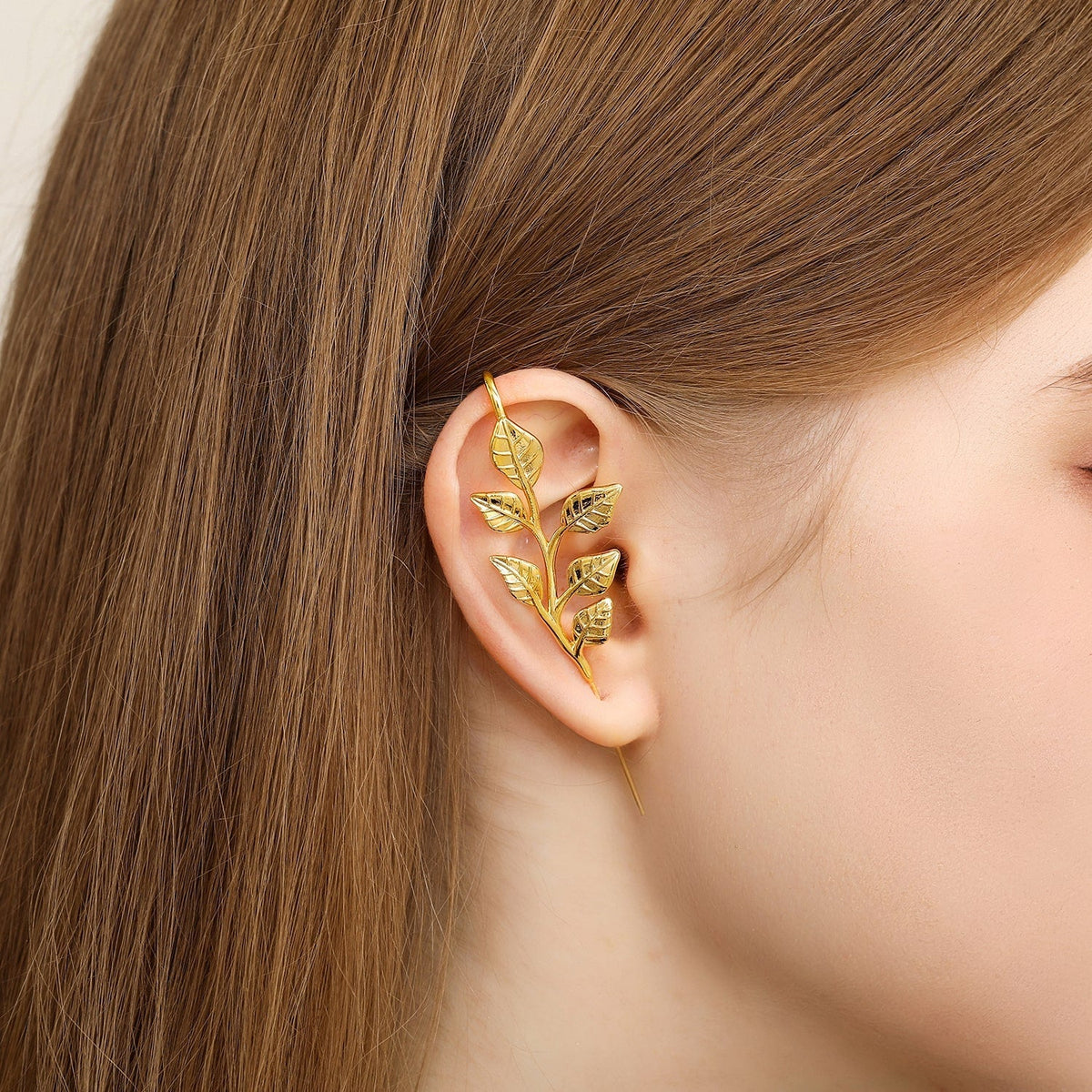 Whispering Leaves ear cuff worn on the ear, profile view