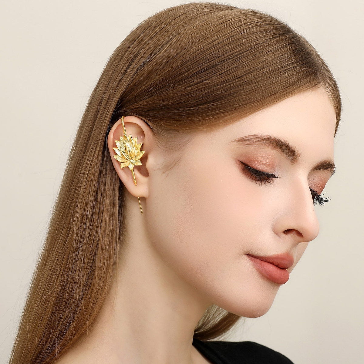 Lotus Bloom ear cuff worn on the ear, profile view