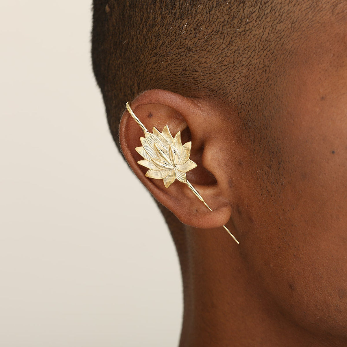 Lotus Bloom ear cuff worn on the ear, profile view