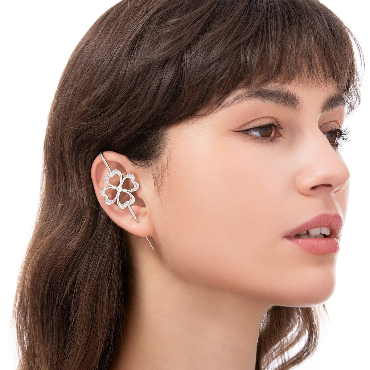 Lucky Clover ear cuff worn on the ear, profile view
