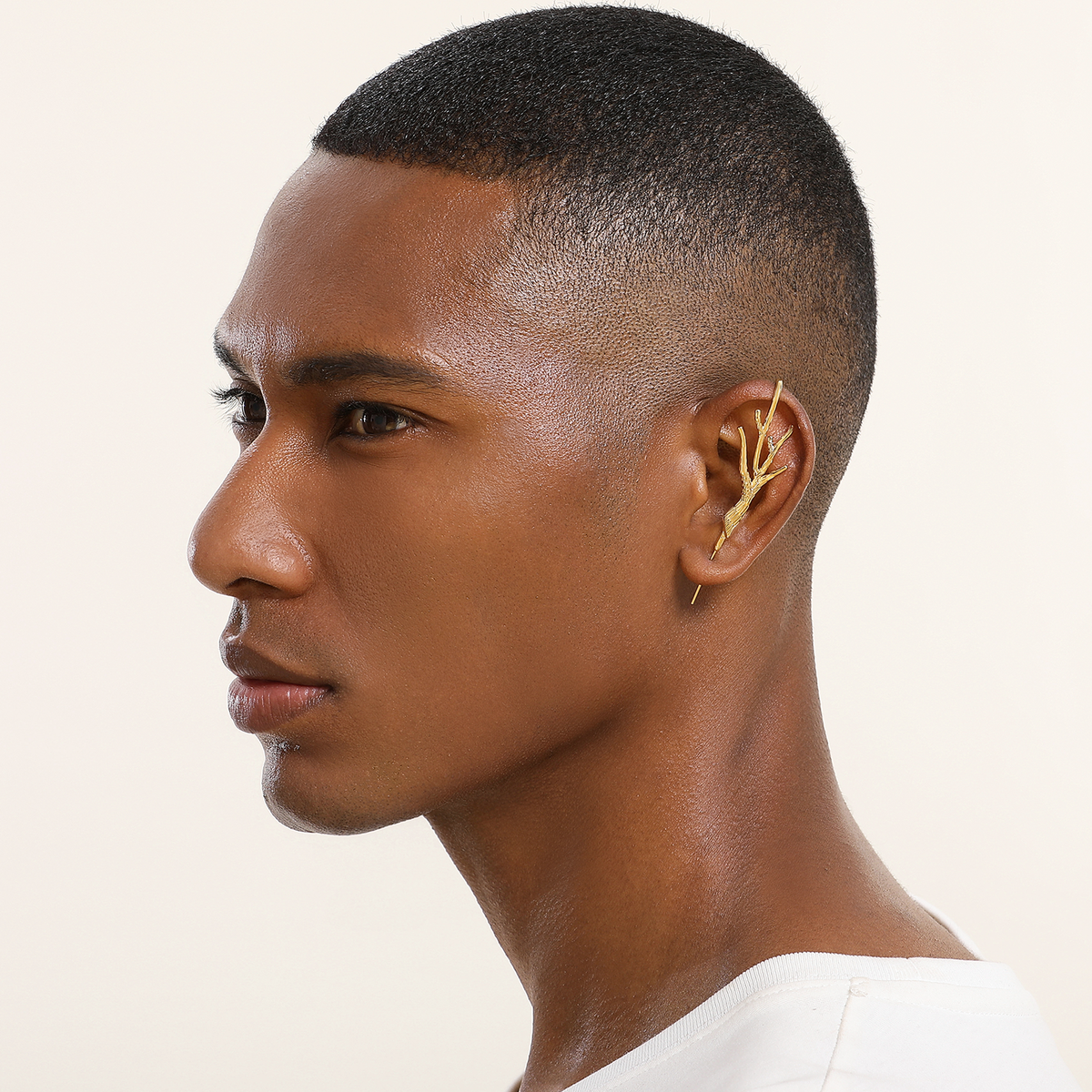 Nature's Embrace ear cuff in gold worn on the ear, profile view