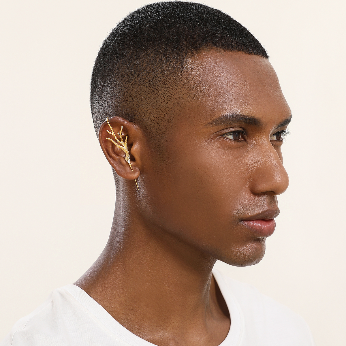 Nature's Embrace ear cuff in gold worn on the ear, profile view