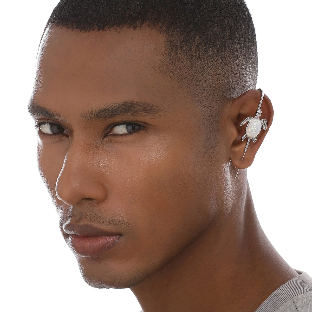 Ocean Guardian ear cuff worn on the ear, profile view