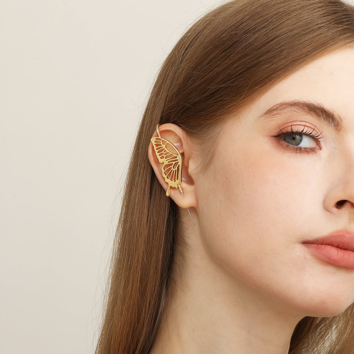 Gentle Butterfly ear cuff worn on the ear, profile view
