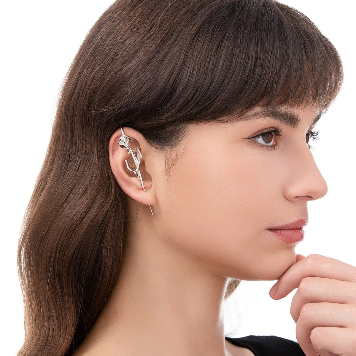 Radiant Rose ear cuff worn on the ear, profile view