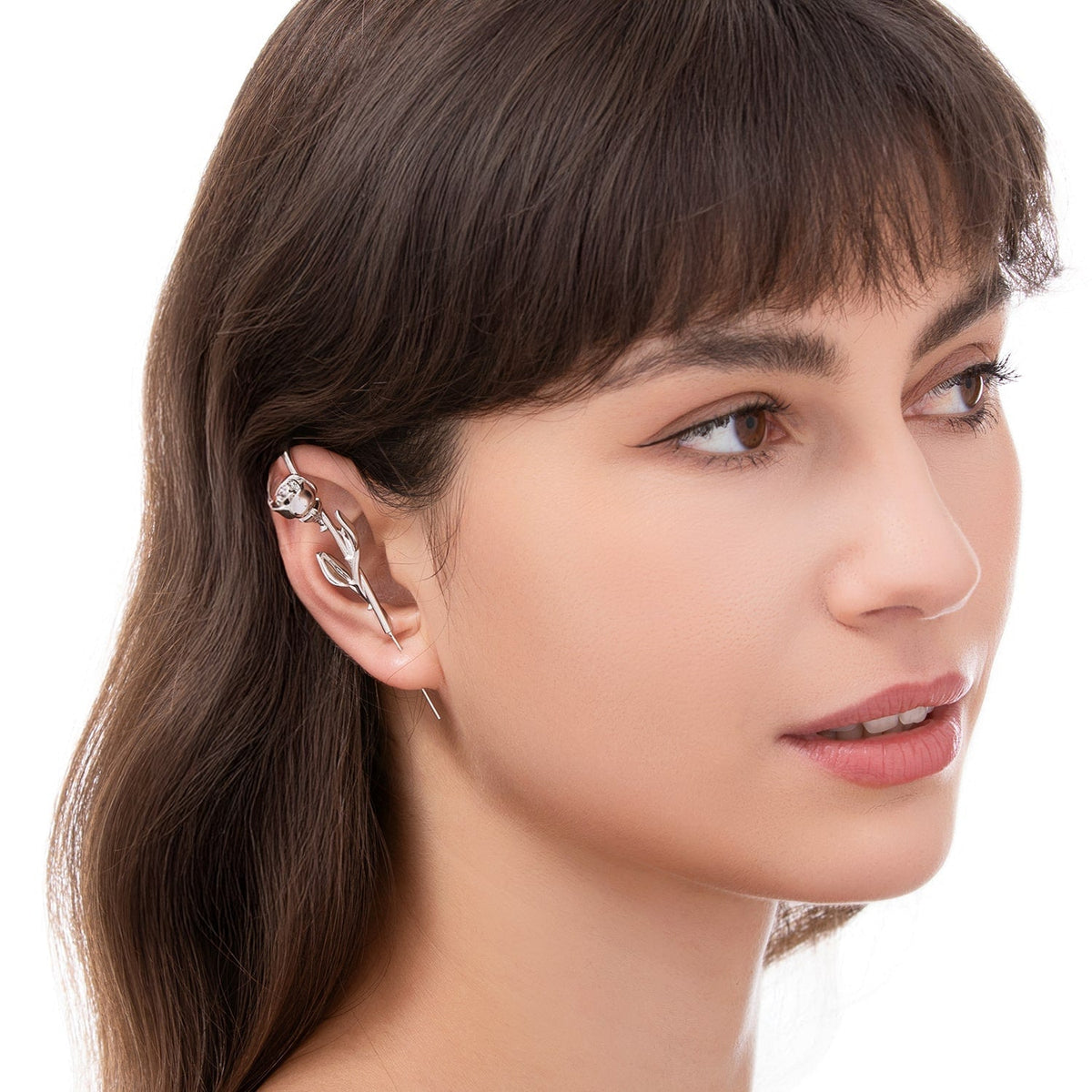 Radiant Rose ear cuff worn on the ear, profile view