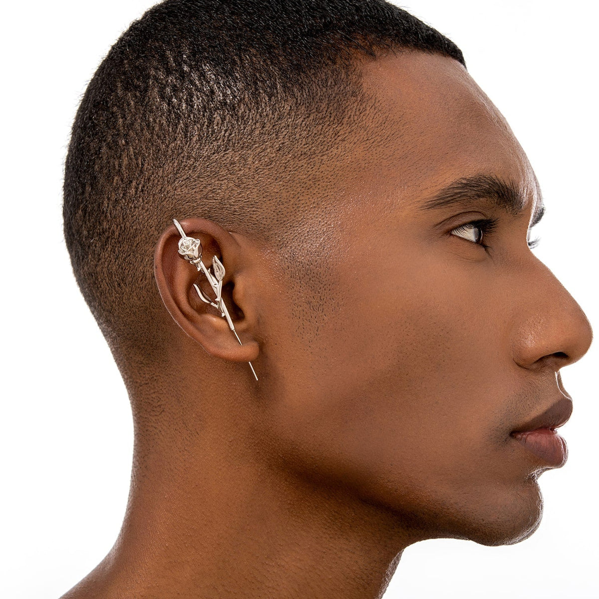 Radiant Rose ear cuff worn on the ear, profile view