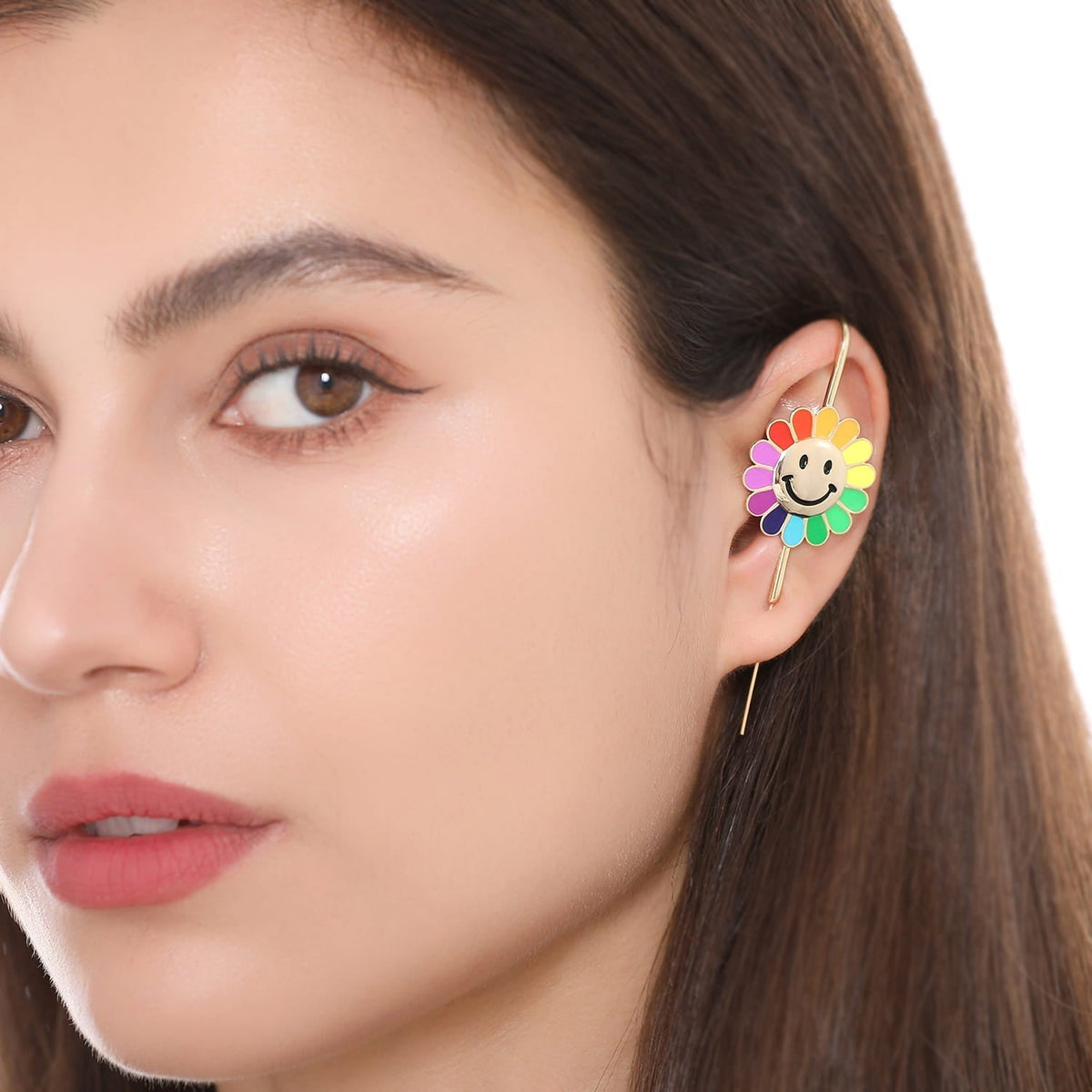 Rainbow Flower ear cuff worn on the ear, profile view