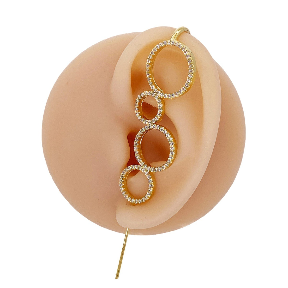 Linked Circles ear cuff in gold on a black ear form