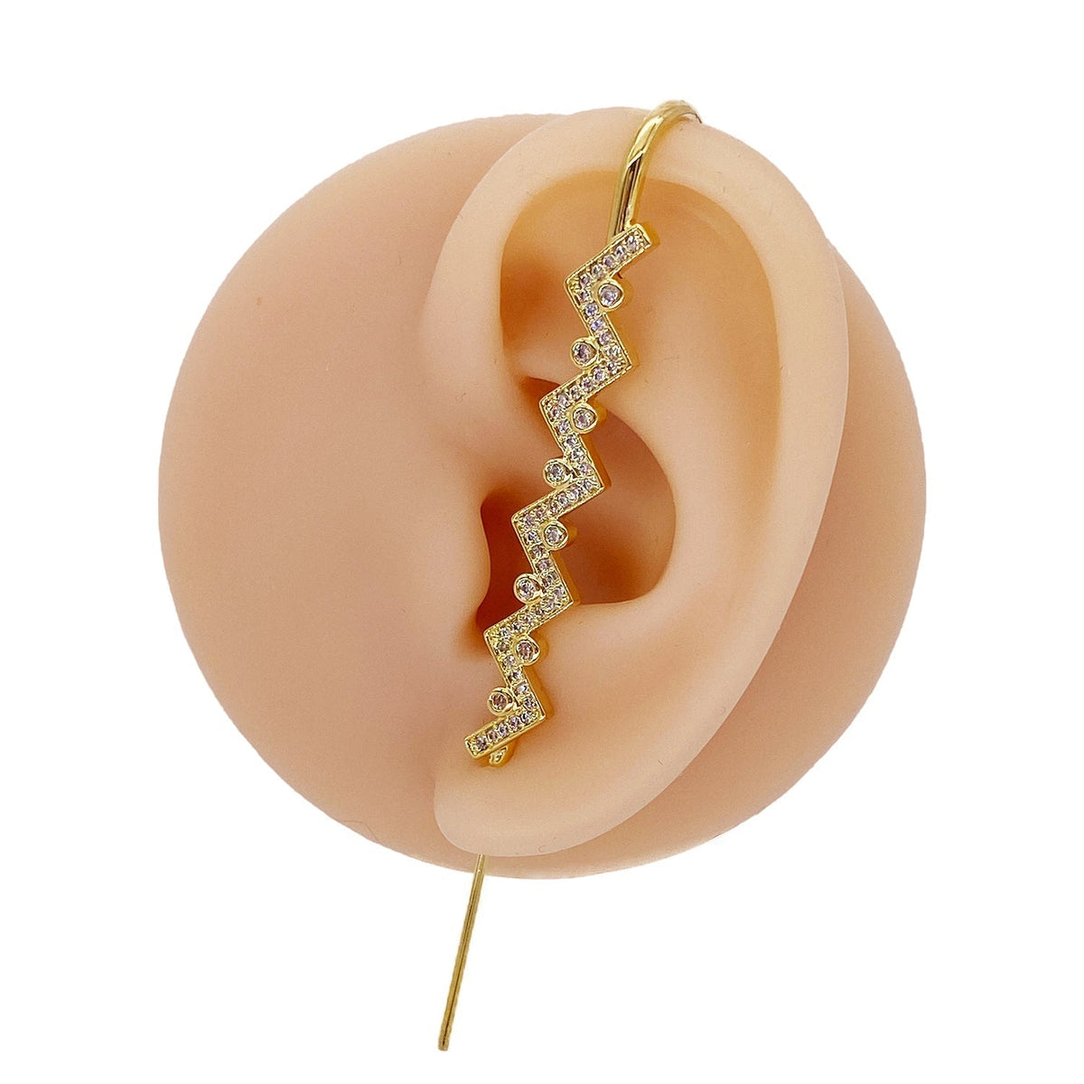 Traces ear cuff in gold on a black ear form