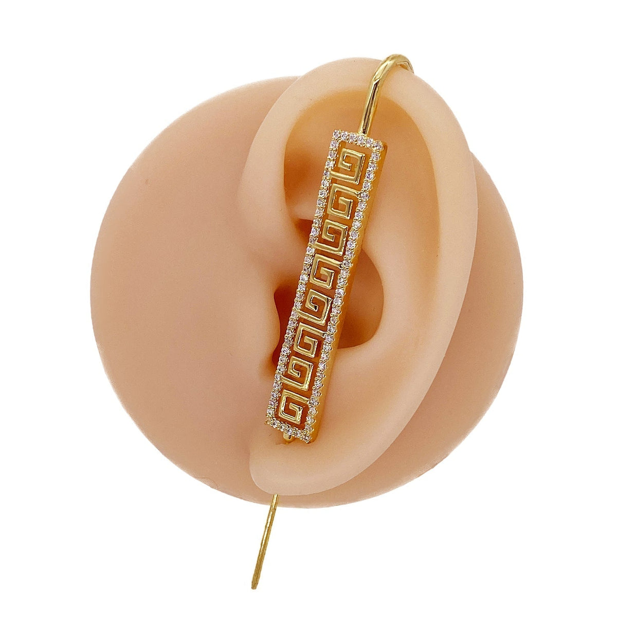 Tribal ear cuff in gold on a black ear form
