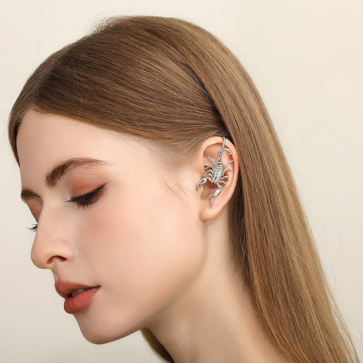 Fierce Scorpion ear cuff worn on the ear, profile view