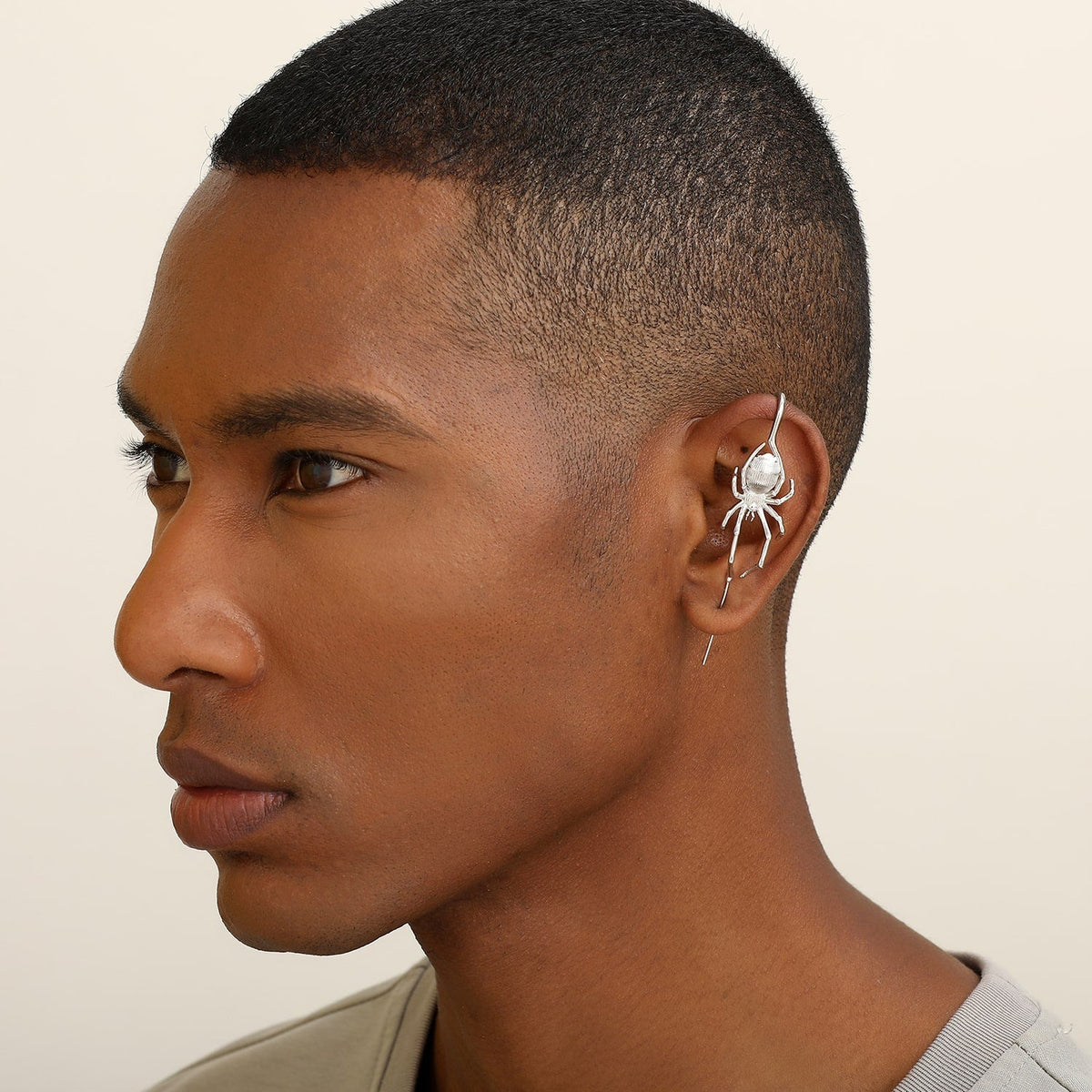 Arachnid Kiss ear cuff worn on the ear, profile view