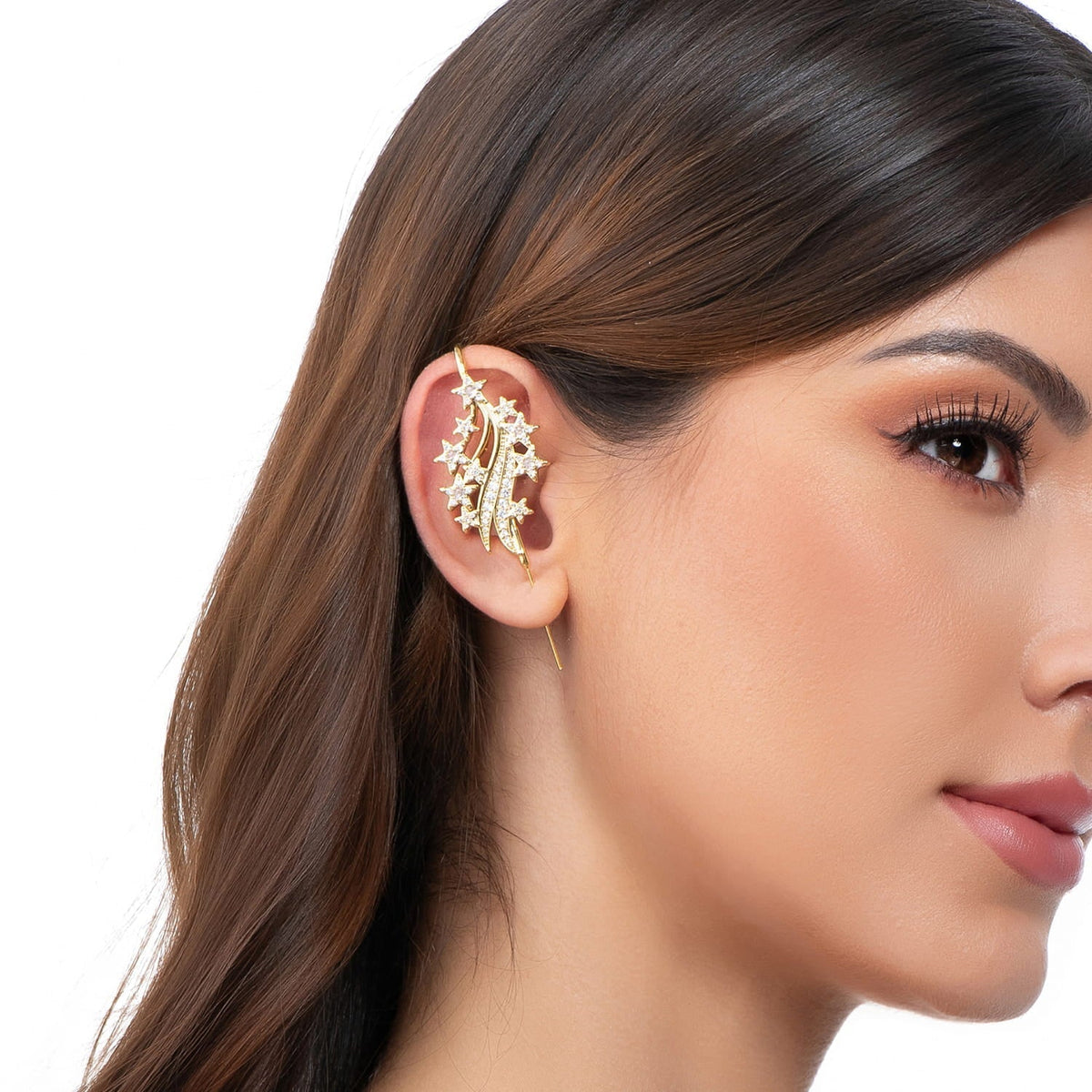 Starfall ear cuff in gold on a black ear form