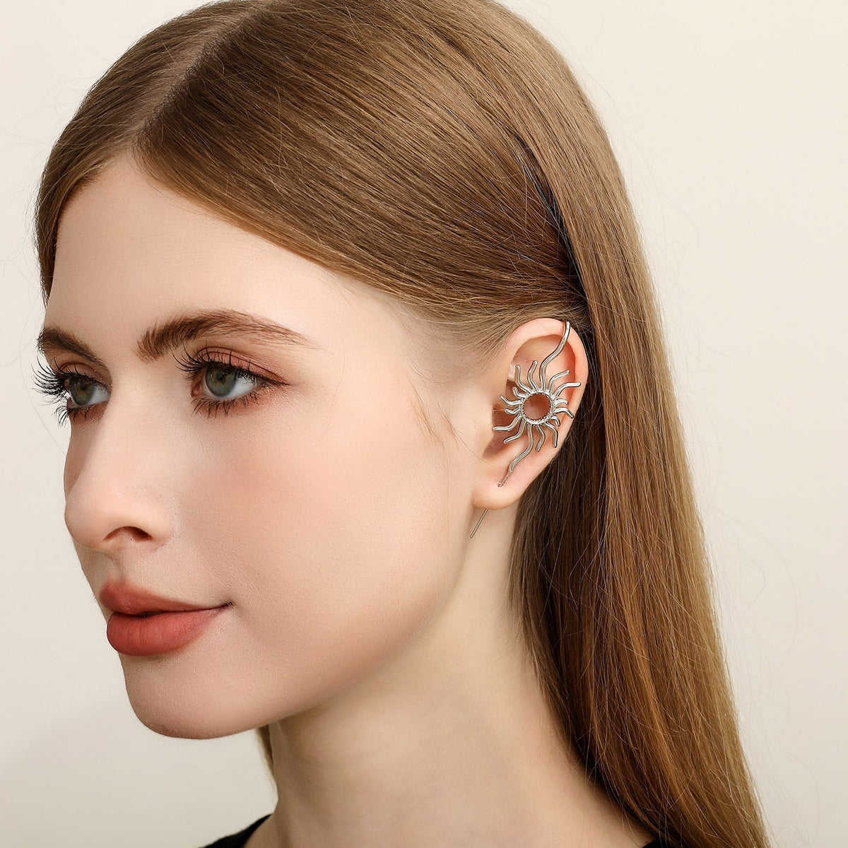 Sunfire ear cuff worn on the ear, profile view