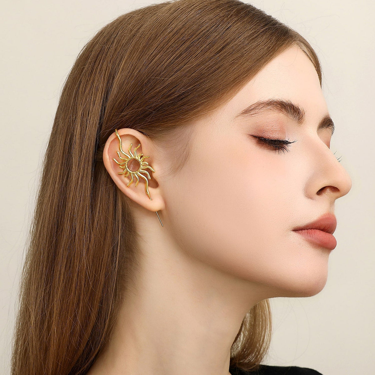 Sunfire ear cuff worn on the ear, profile view