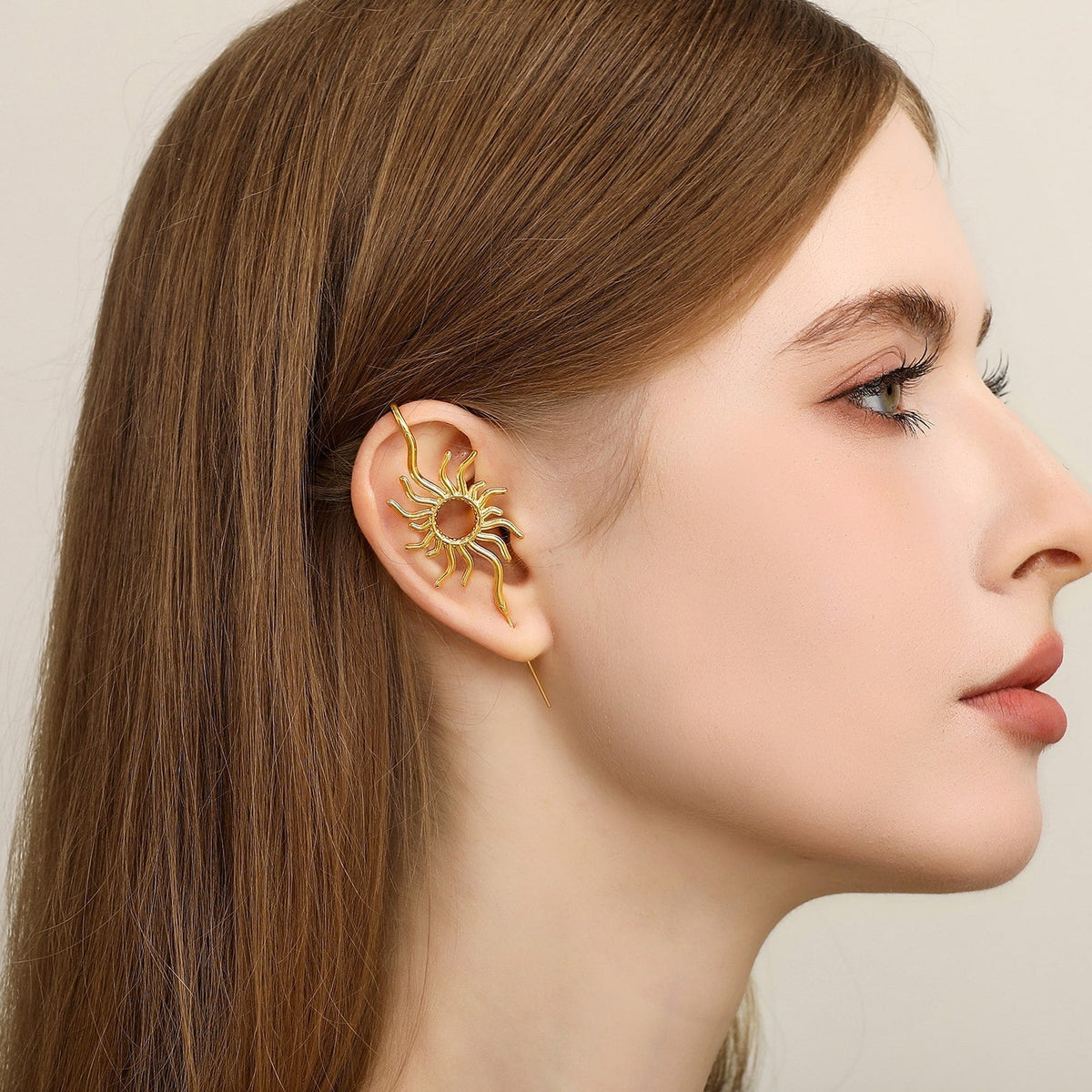 Sunfire ear cuff worn on the ear, profile view