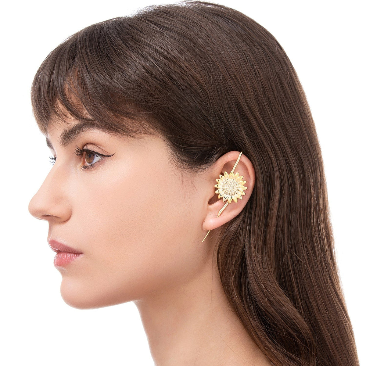 Sunflower ear cuff worn on the ear, profile view