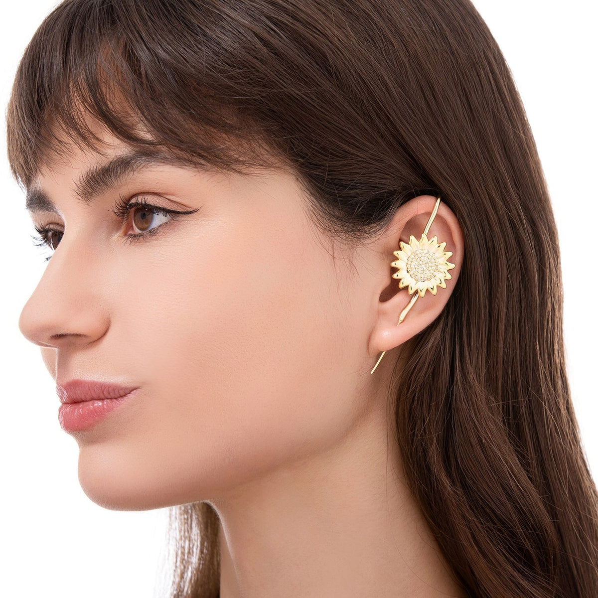 Sunflower ear cuff worn on the ear, profile view