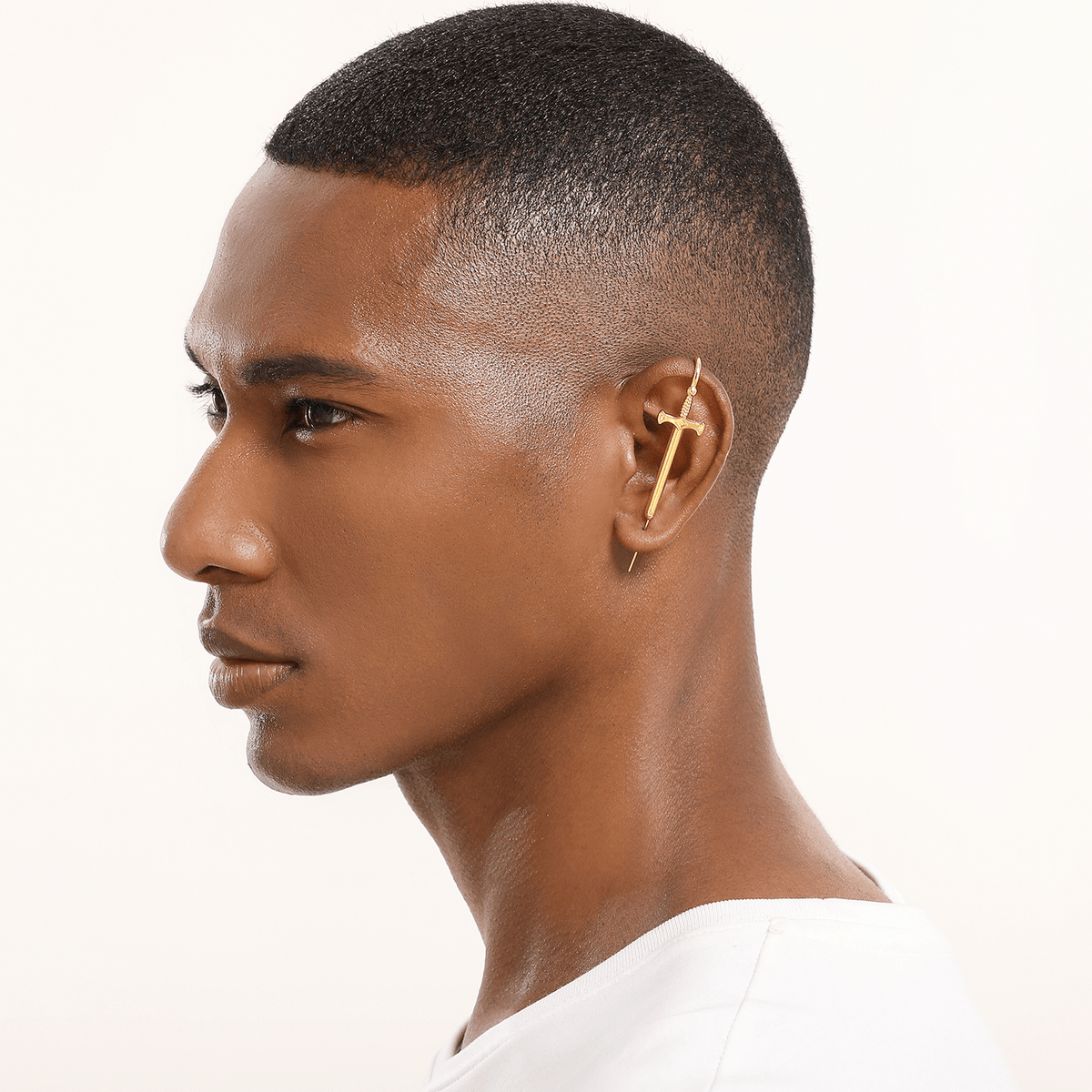 Titan's Edge ear cuff in gold worn on the ear, profile view