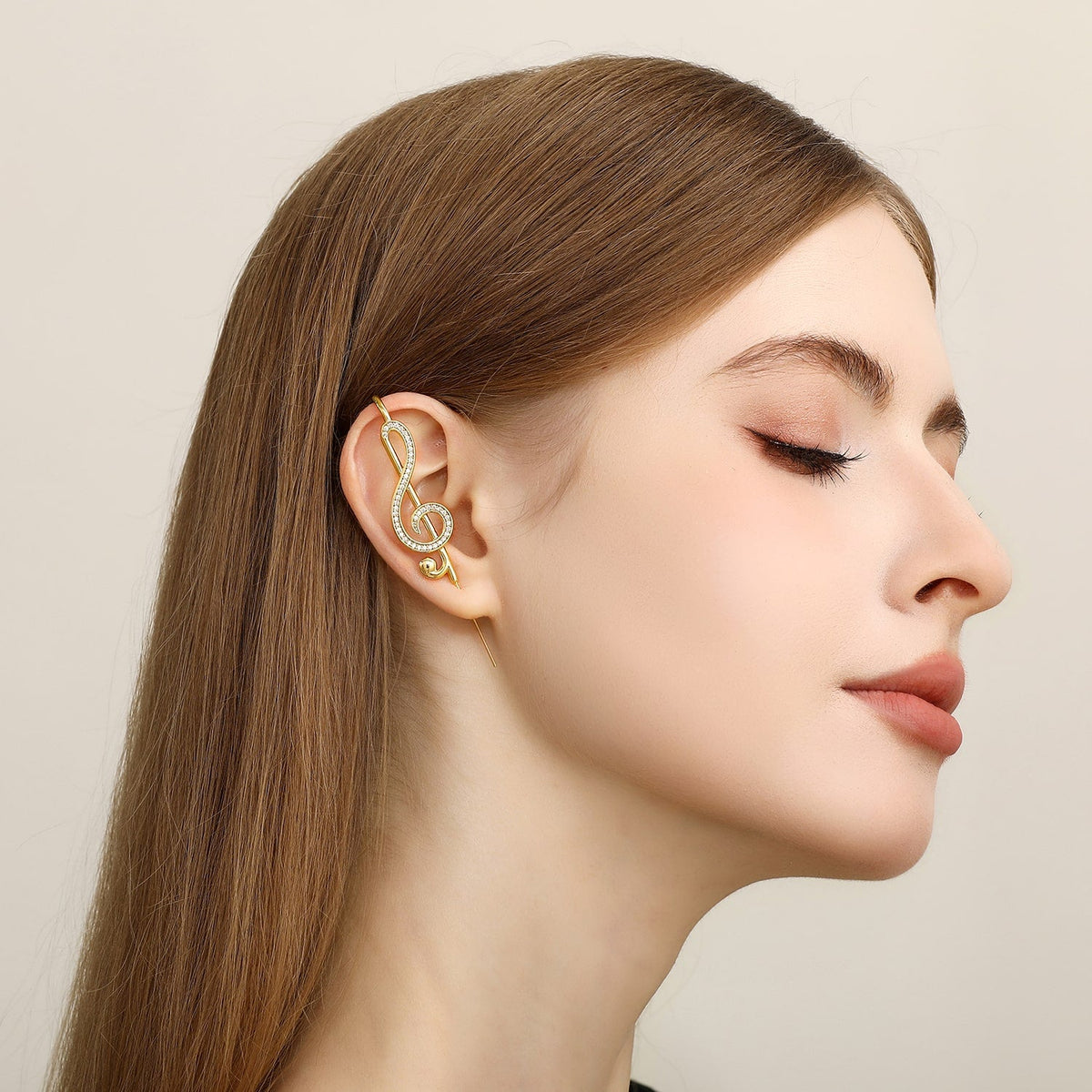 Treble Clef ear cuff worn on the ear, profile view