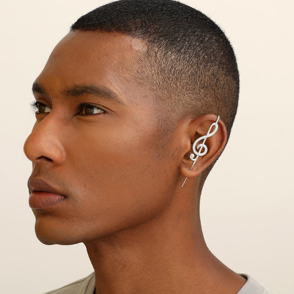 Treble Clef ear cuff worn on the ear, profile view