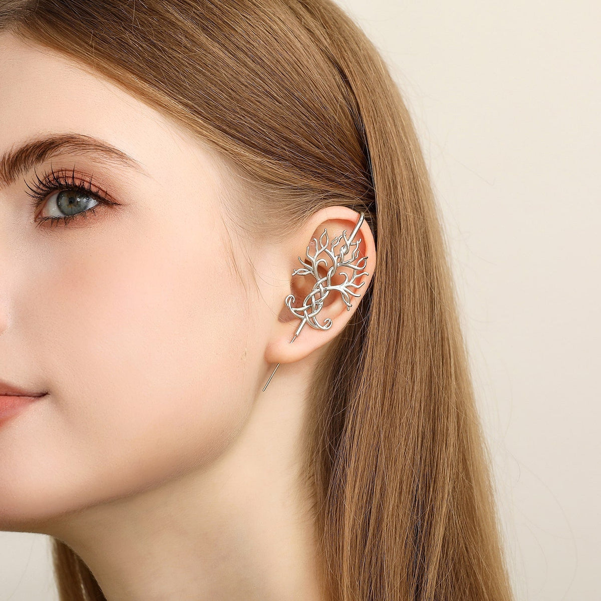 Tree of Life ear cuff worn on the ear, profile view