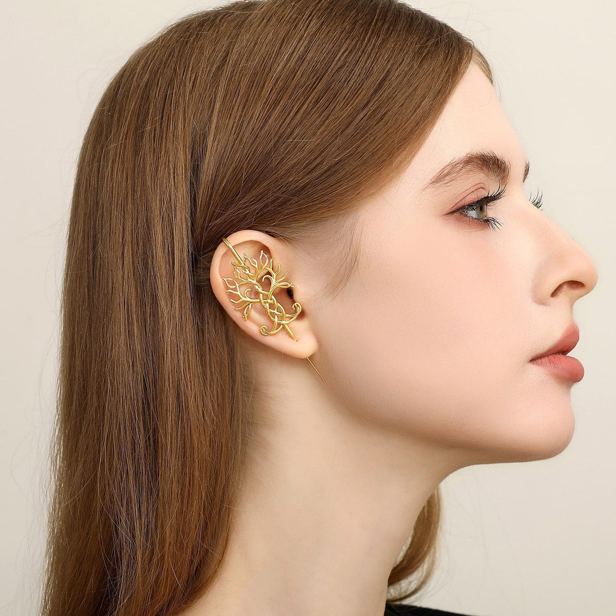 Tree of Life ear cuff worn on the ear, profile view