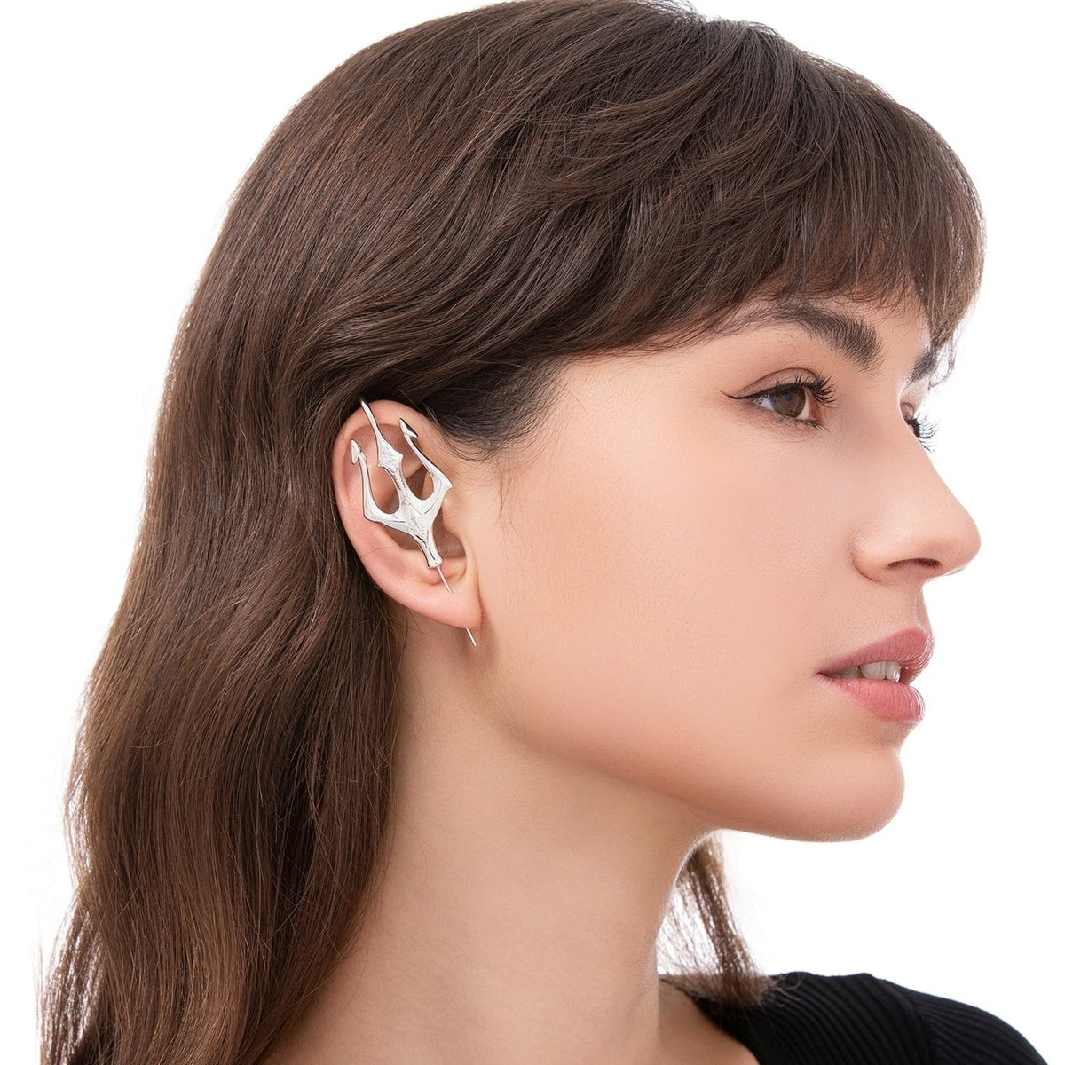 Poseidon's Trident ear cuff worn on the ear, profile view