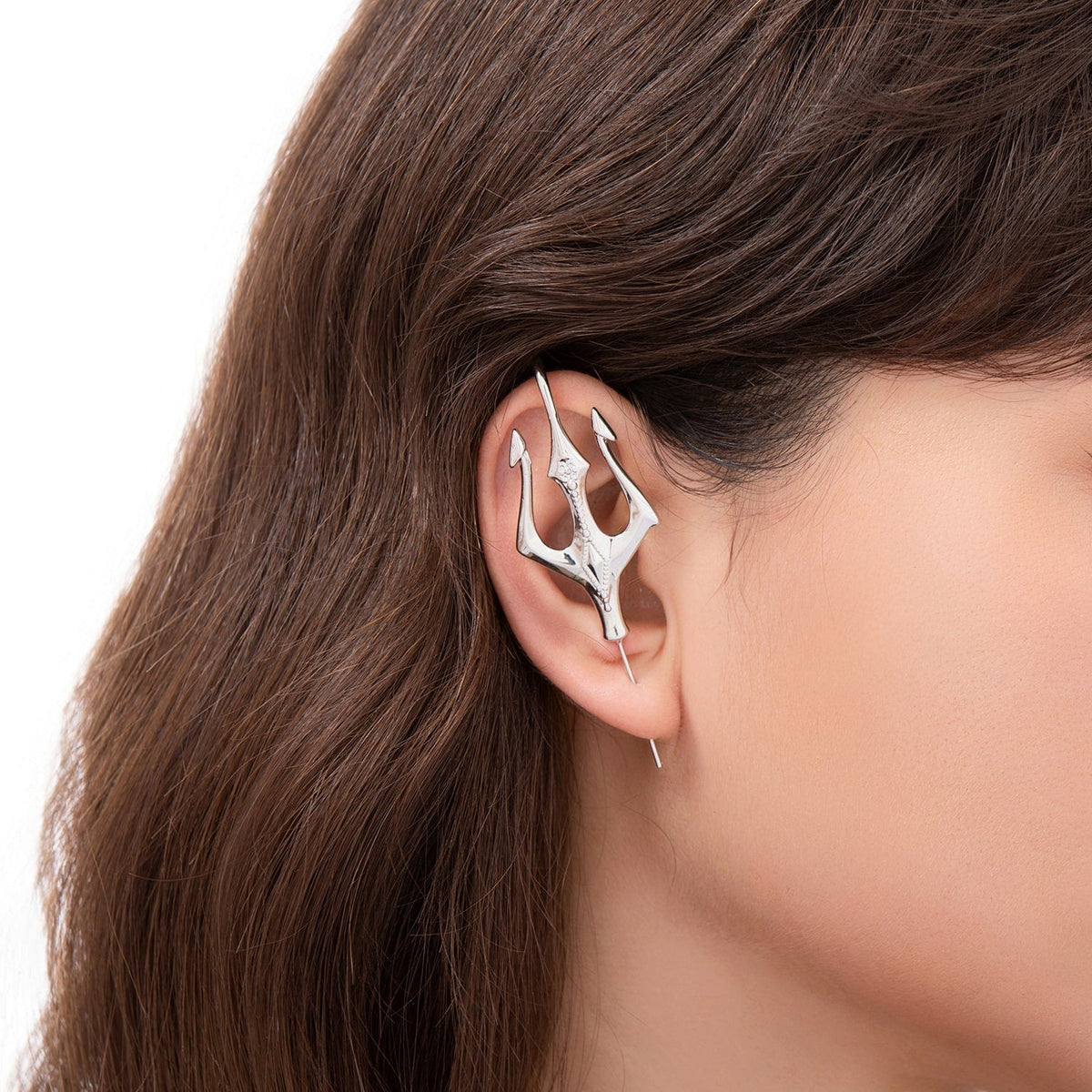 Poseidon's Trident ear cuff worn on the ear, profile view