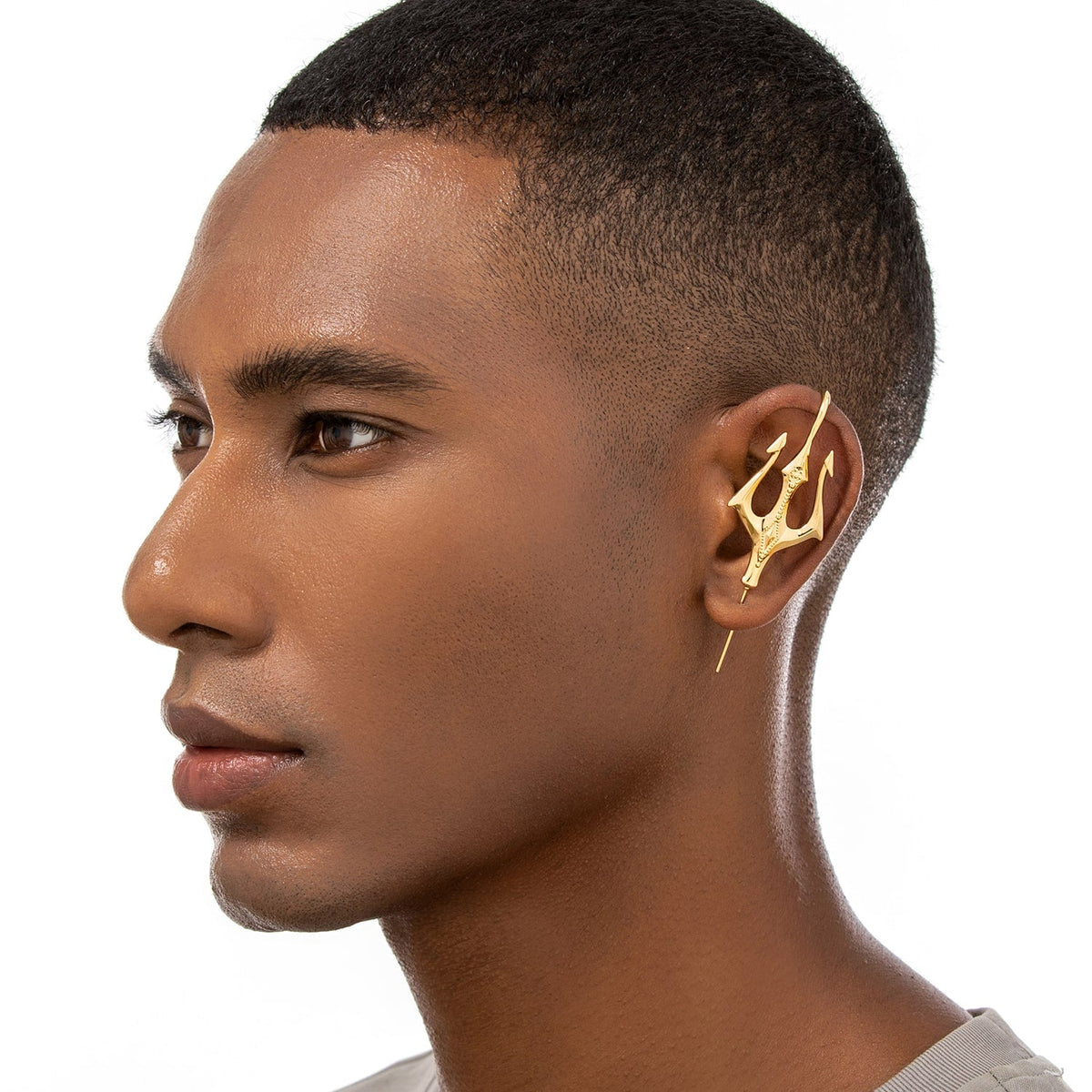Poseidon's Trident ear cuff worn on the ear, profile view