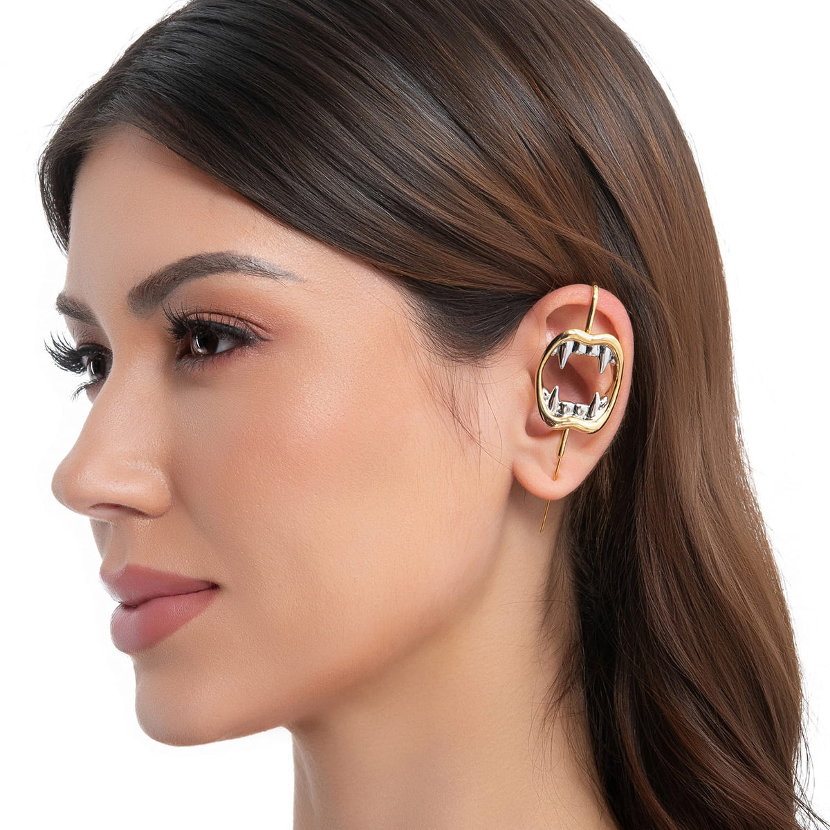 Vampire Fangs ear cuff in gold on a black ear form