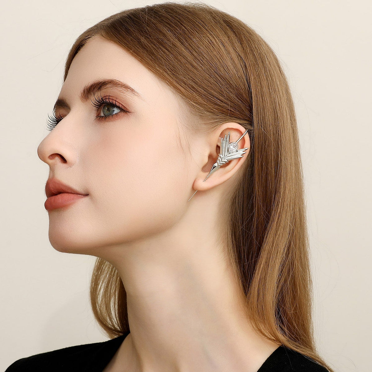 Cosmic Wand ear cuff worn on the ear, profile view