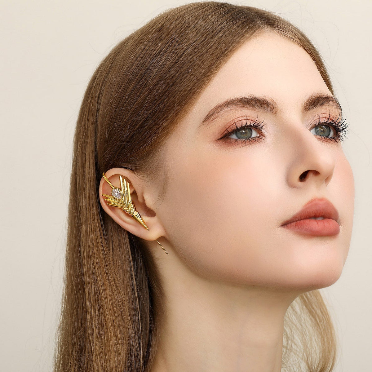 Cosmic Wand ear cuff worn on the ear, profile view