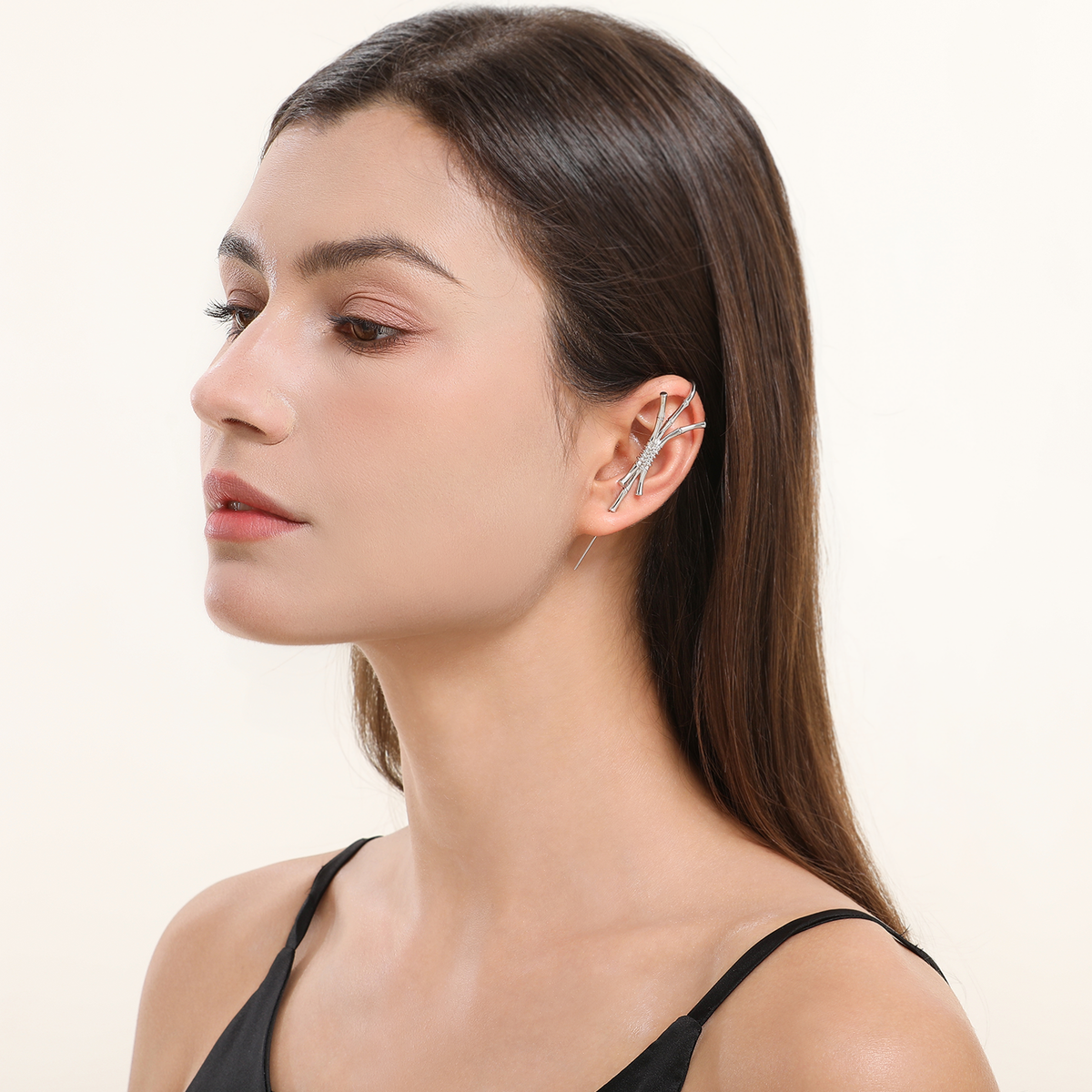 Ward of Protection ear cuff in silver worn on the ear, profile view