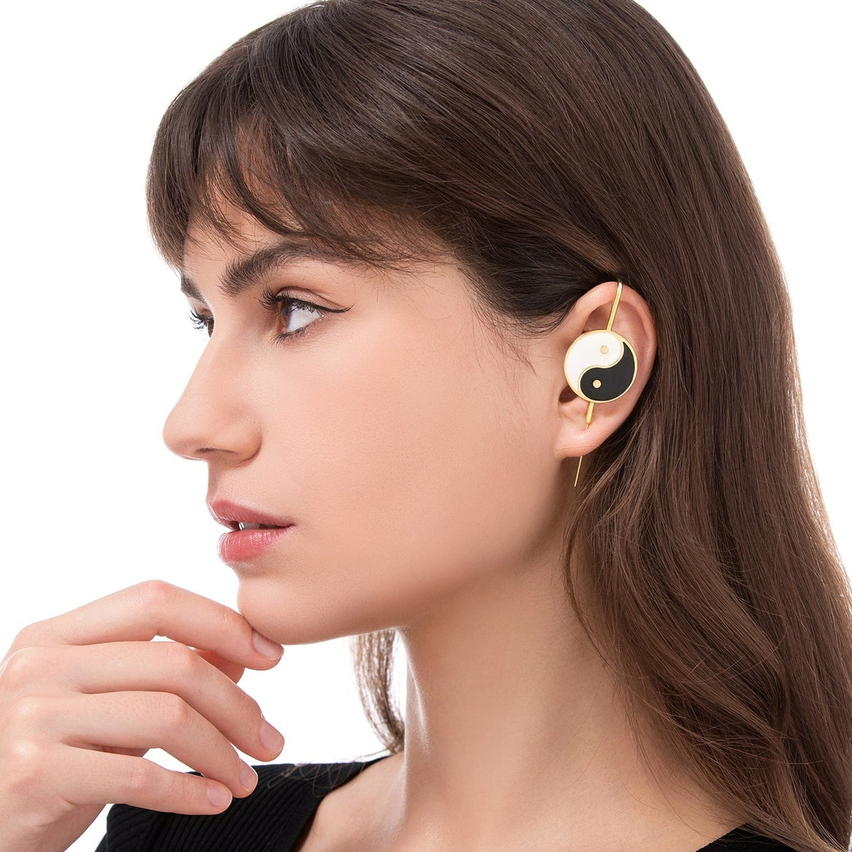 Yin & Yang ear cuff worn on the ear, profile view