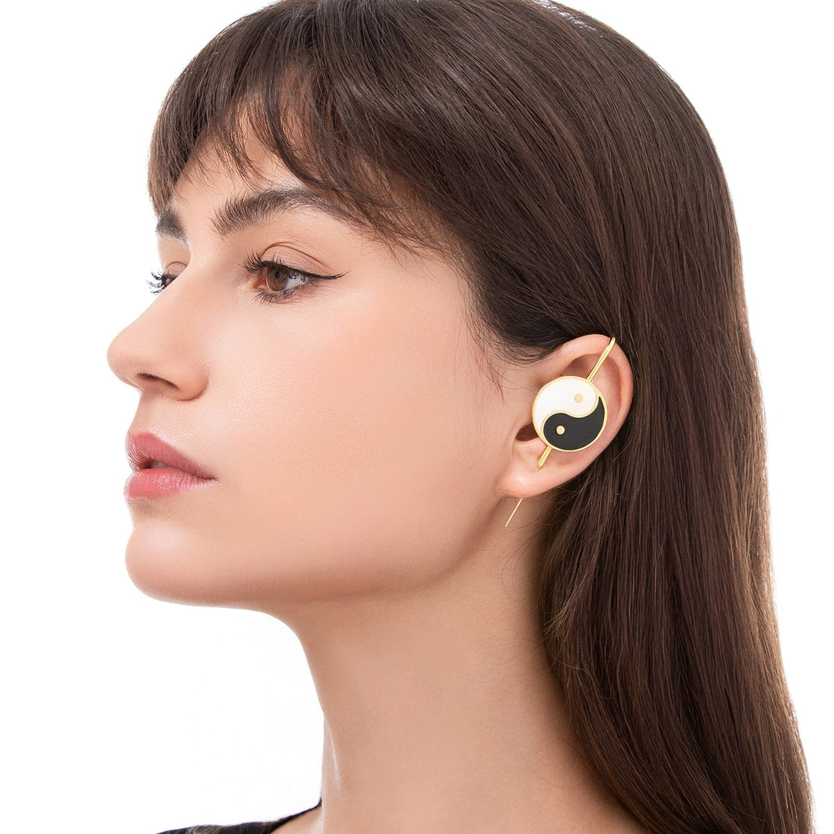 Yin & Yang ear cuff worn on the ear, profile view